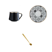Lade das Bild in den Galerie-Viewer, Kaffeetasse mit Unterteller in schwarz-weißen Muster und goldenen Akzenten inkl. goldenem Löffel
